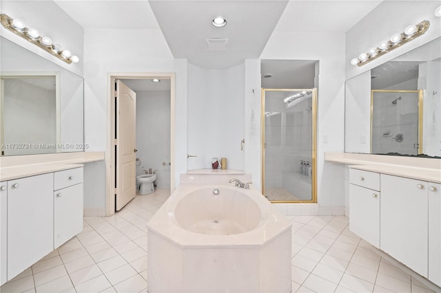 bathroom with a bidet, vanity, independent shower and bath, and tile patterned flooring