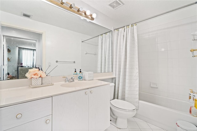 full bathroom with shower / bathtub combination with curtain, vanity, a textured ceiling, tile patterned floors, and toilet