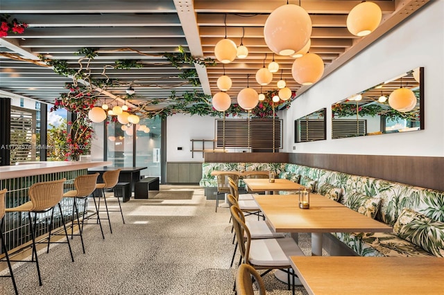 dining area featuring indoor bar