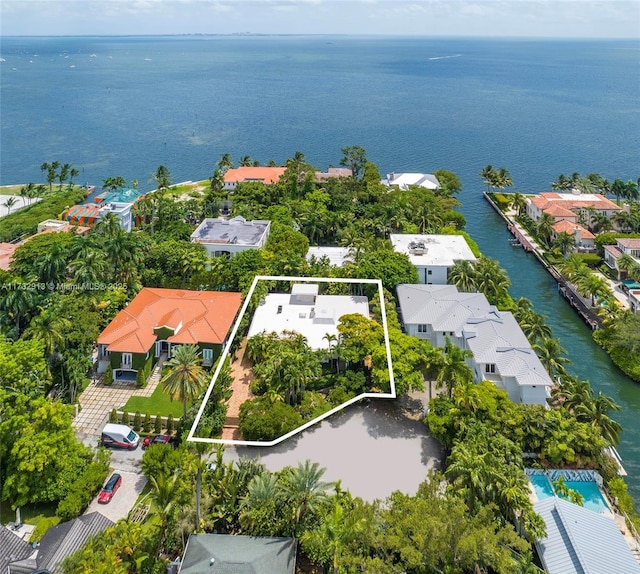 drone / aerial view featuring a water view and a residential view