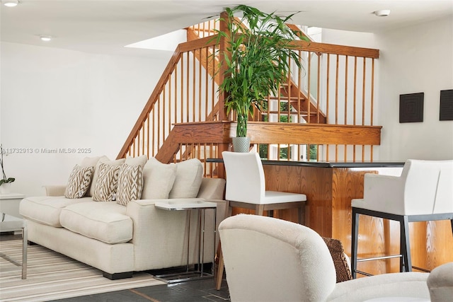living area featuring stairs