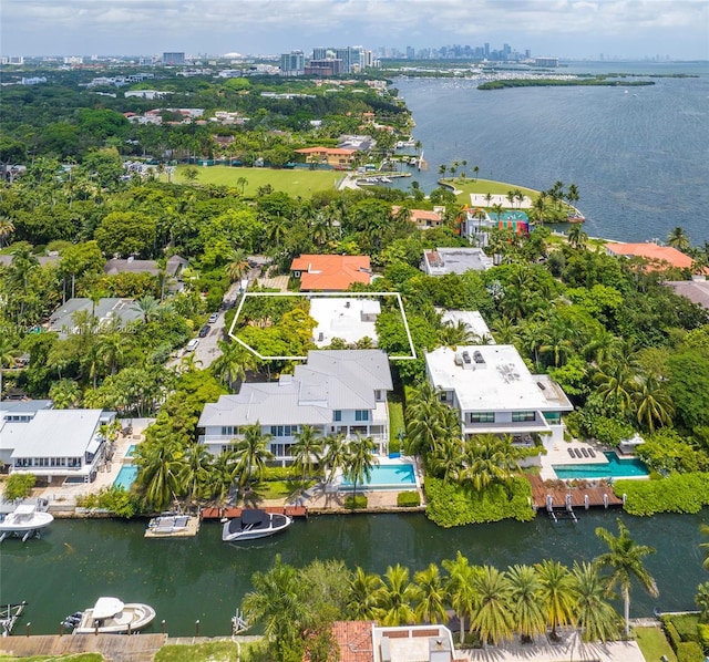 bird's eye view featuring a water view and a view of city