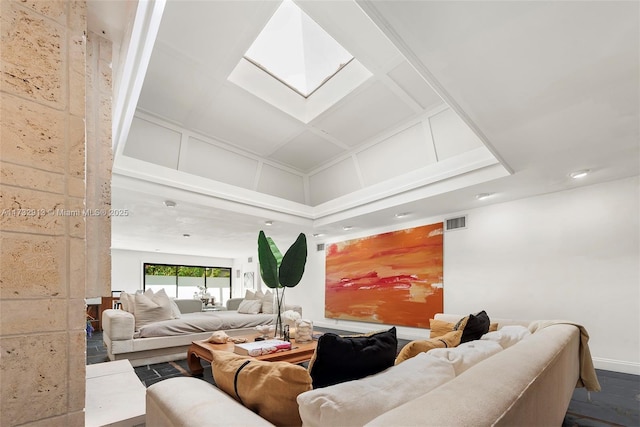 living area featuring dark wood-style flooring, a skylight, coffered ceiling, and visible vents