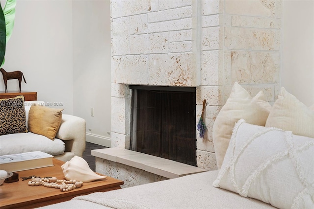 room details with a tile fireplace and baseboards