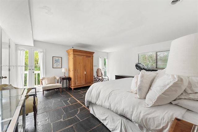 bedroom with access to outside and french doors