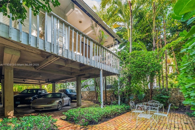 view of parking / parking lot with a carport