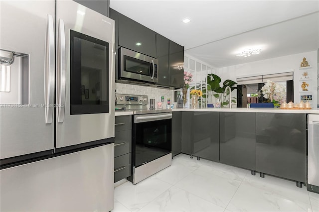 kitchen featuring tasteful backsplash and appliances with stainless steel finishes