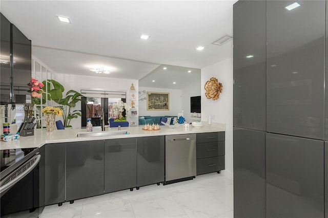 kitchen with sink and appliances with stainless steel finishes