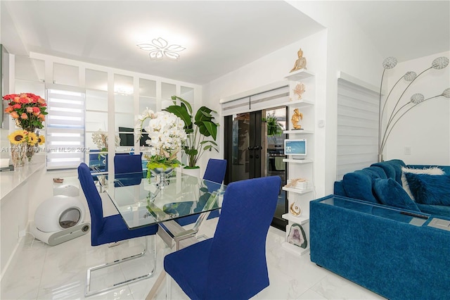 dining space with french doors and a wealth of natural light