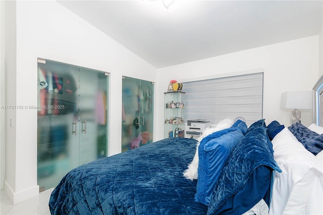 bedroom featuring vaulted ceiling