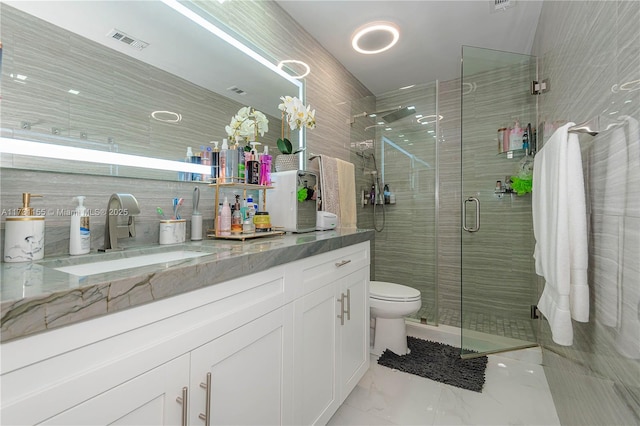 bathroom with vanity, toilet, and walk in shower