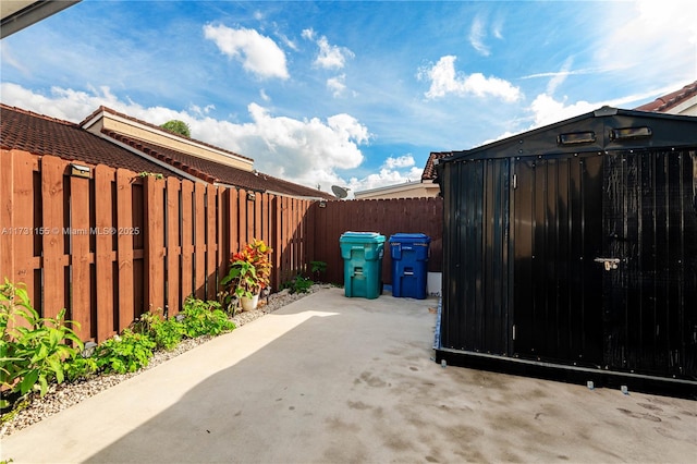 view of patio / terrace featuring a storage shed