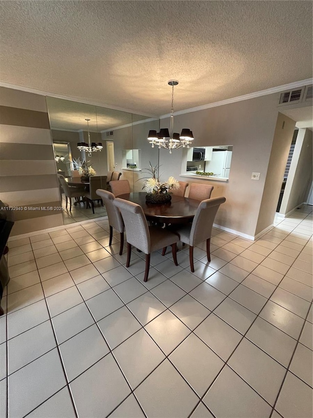 tiled dining space featuring an inviting chandelier, crown molding, and a textured ceiling