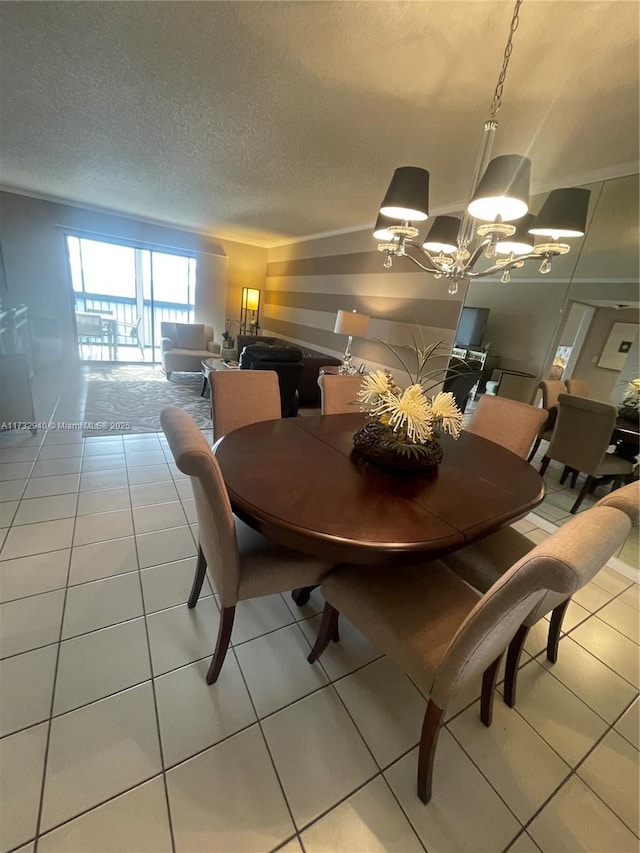 tiled dining room with an inviting chandelier