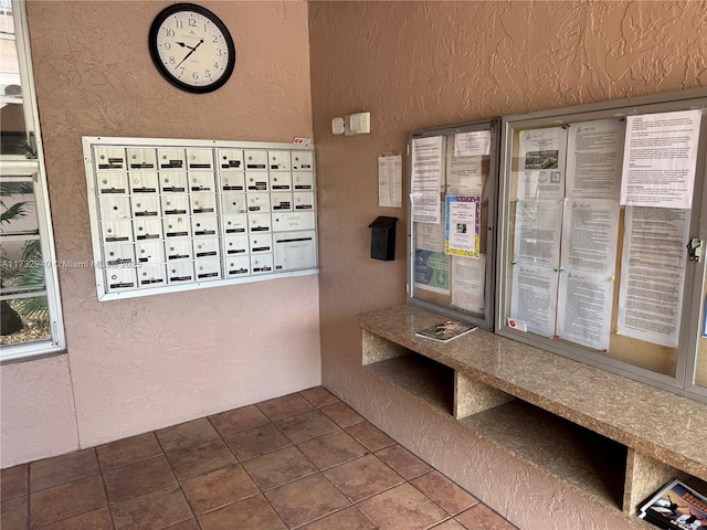 view of home's community featuring a mail area