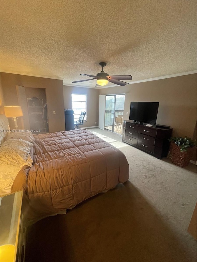 bedroom featuring a textured ceiling, access to outside, ceiling fan, and carpet