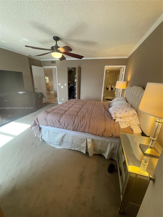 carpeted bedroom featuring crown molding, ceiling fan, and a textured ceiling