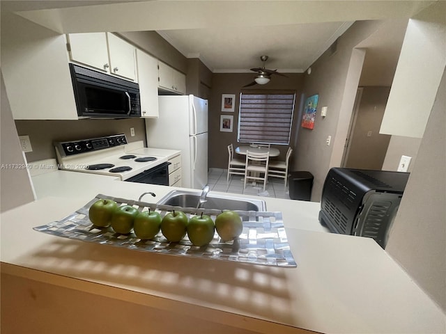 kitchen with sink, crown molding, white appliances, ceiling fan, and white cabinets