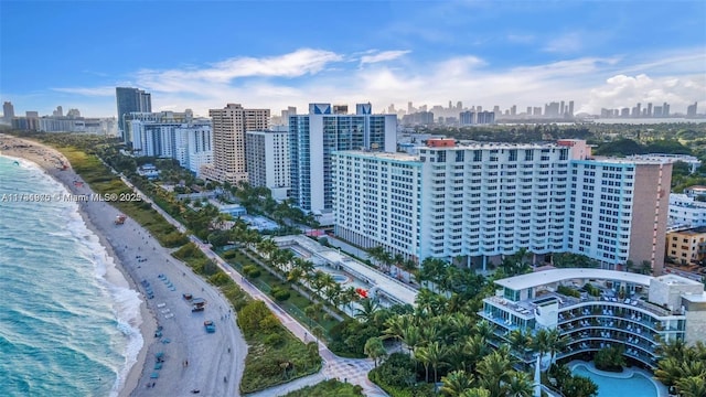 bird's eye view featuring a beach view and a water view