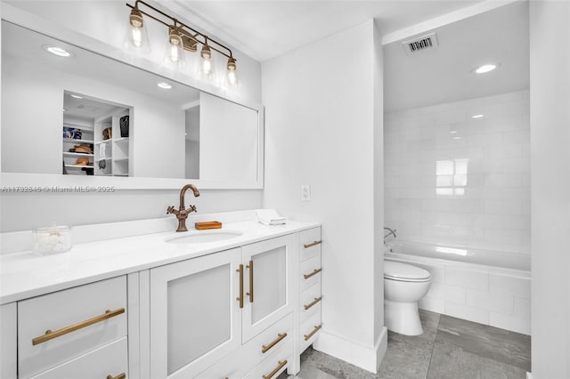 bathroom featuring vanity and toilet