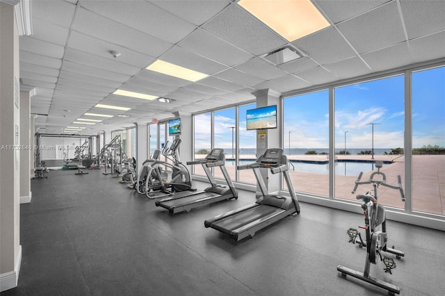 workout area featuring a drop ceiling