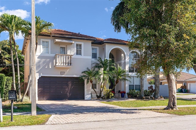 mediterranean / spanish-style house featuring a garage