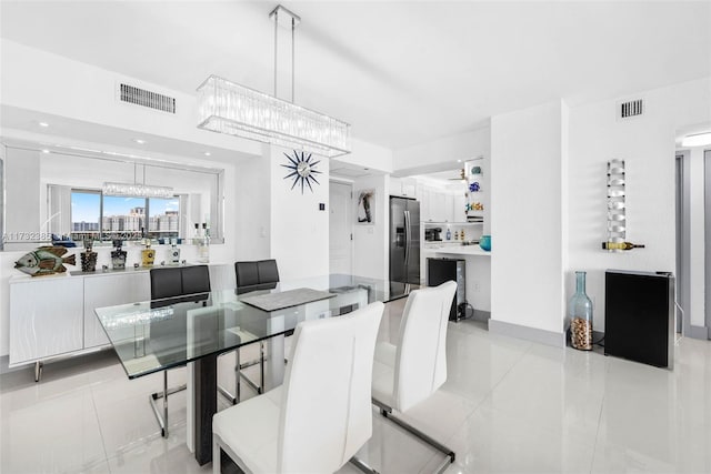 3675 N Country Club Dr Unit 1006, Aventura, FL 33180 - dining area featuring a chandelier and light tile patterned floors