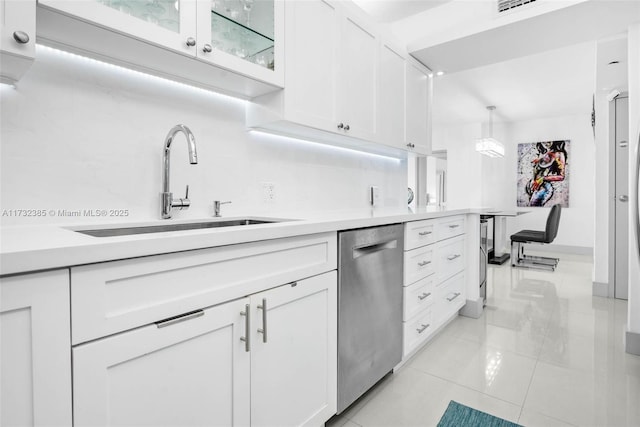 3675 N Country Club Dr Unit 1006, Aventura, FL 33180 - kitchen featuring stainless steel dishwasher, white cabinets, light countertops, glass insert cabinets, and decorative light fixtures
