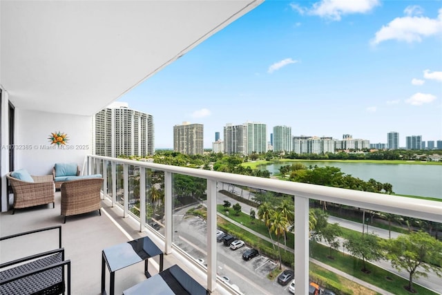3675 N Country Club Dr Unit 1006, Aventura, FL 33180 - balcony with a water view, a view of skyline, and an outdoor hangout area