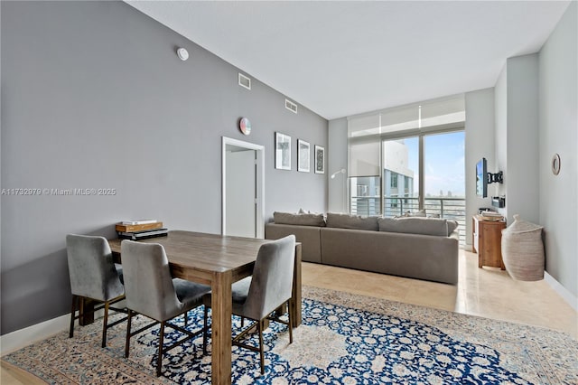 dining room featuring expansive windows