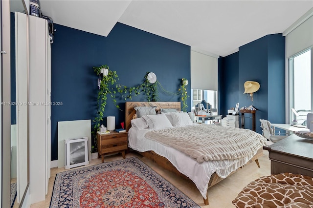 bedroom featuring multiple windows