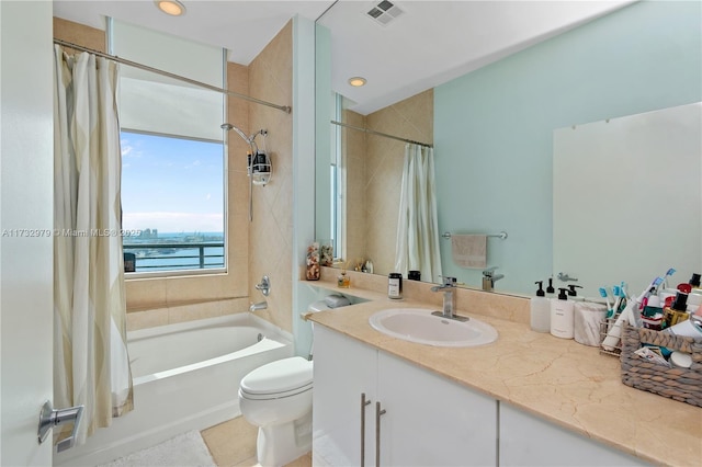 full bathroom with shower / bathtub combination with curtain, a water view, vanity, tile patterned floors, and toilet