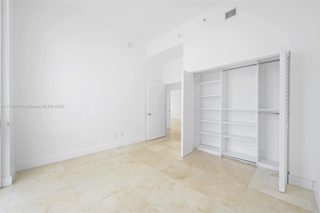 unfurnished bedroom with baseboards and visible vents