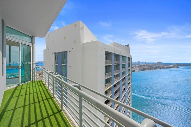 balcony featuring a water view