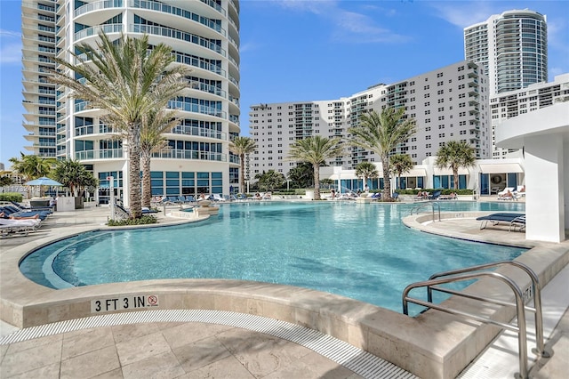 view of swimming pool with a patio area