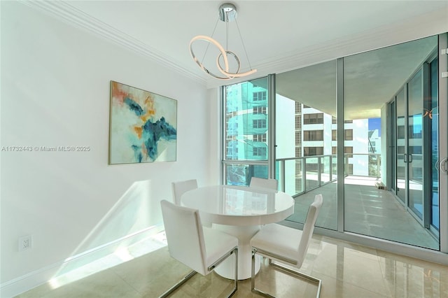 dining space with expansive windows, crown molding, and an inviting chandelier