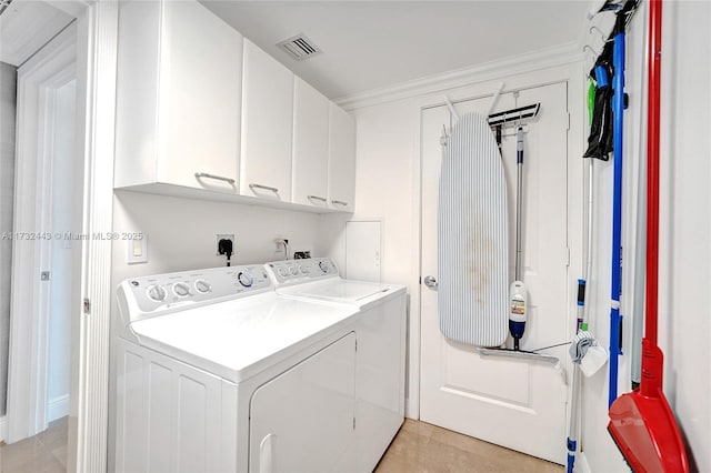 laundry room with ornamental molding, cabinets, independent washer and dryer, and light tile patterned flooring