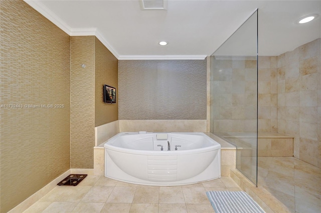 bathroom with ornamental molding, tile patterned flooring, and tiled tub