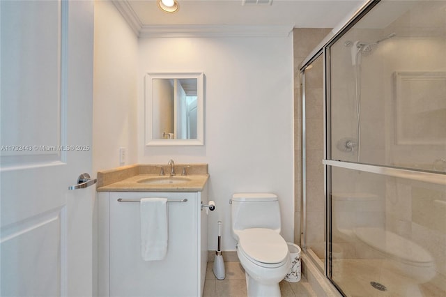 bathroom featuring vanity, a shower with door, ornamental molding, and toilet