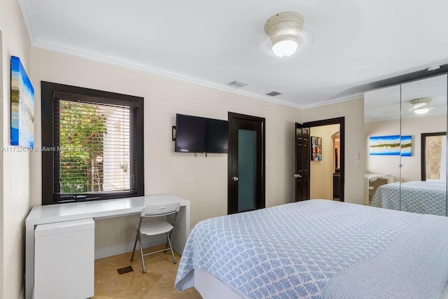 bedroom with crown molding