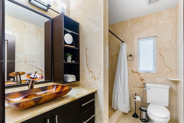 bathroom with vanity, toilet, and a shower with curtain