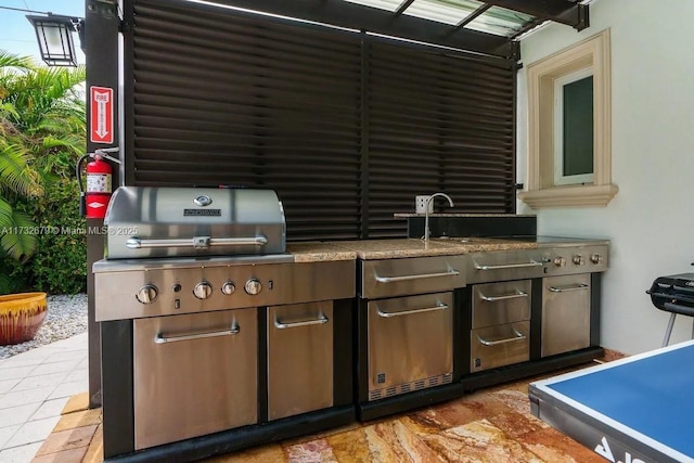 view of patio / terrace with a grill and exterior kitchen