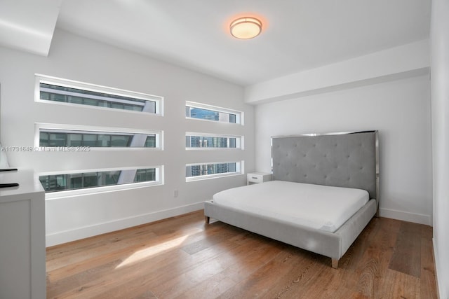 bedroom with light hardwood / wood-style floors