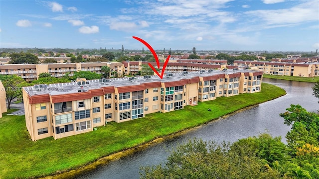 birds eye view of property featuring a water view