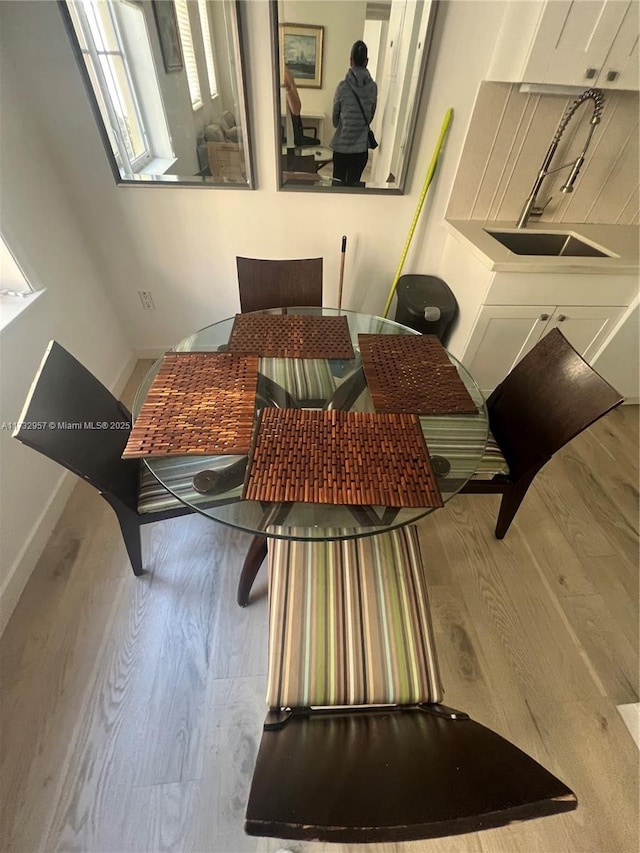 dining room with hardwood / wood-style flooring