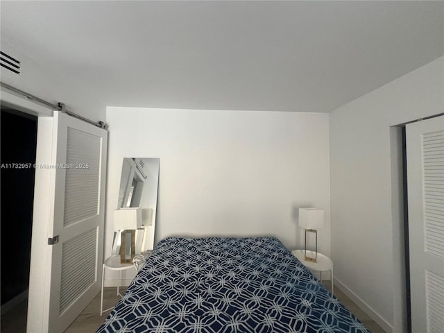 bedroom with a barn door