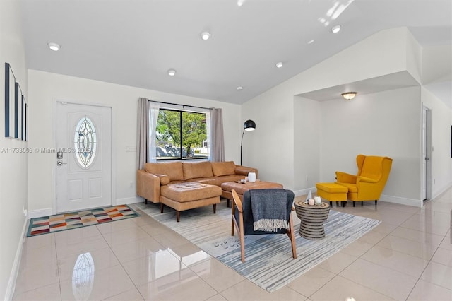 tiled living room featuring vaulted ceiling