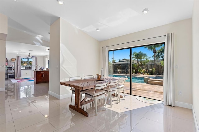 tiled dining area with lofted ceiling