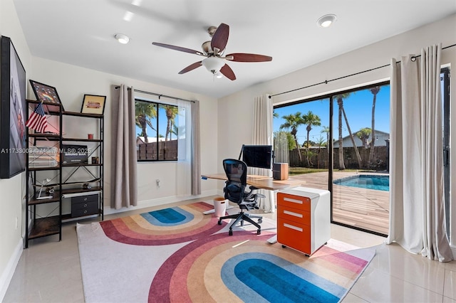 office area with ceiling fan and light tile patterned floors