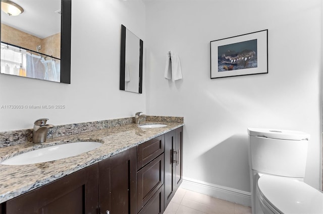 bathroom featuring tile patterned flooring, vanity, a shower with curtain, and toilet